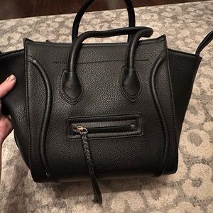Black leather top handle hand bag. Used.
